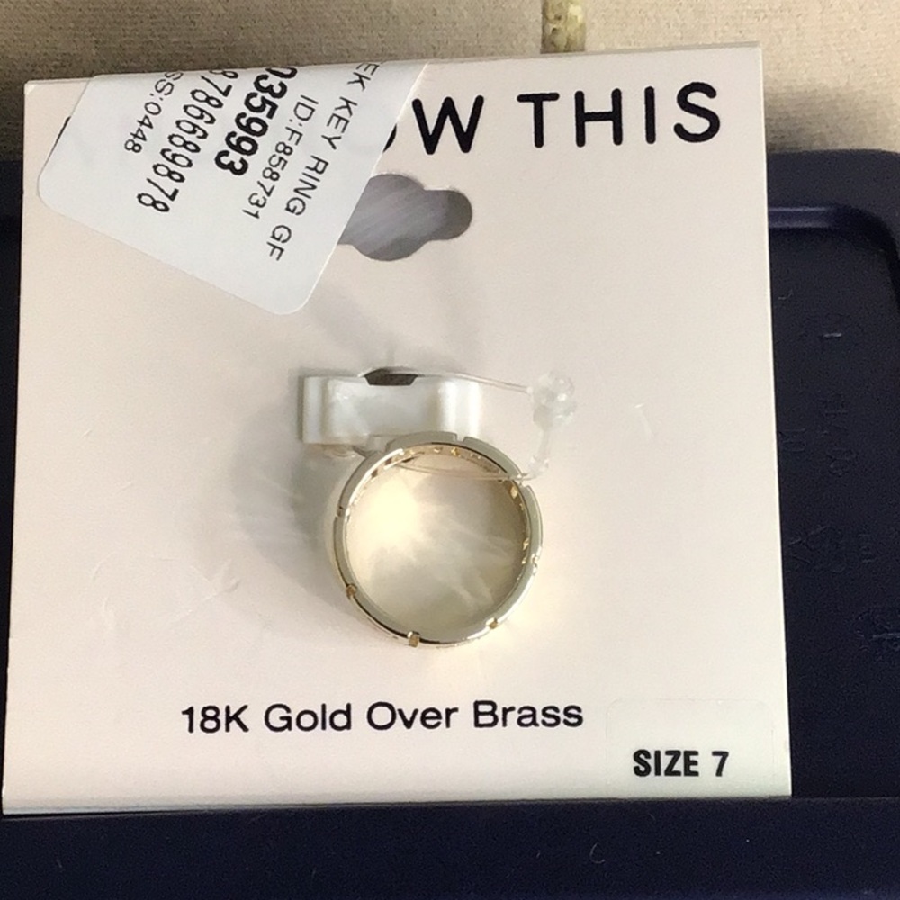 And now this New on tag 18 karat gold over brass ring size 7